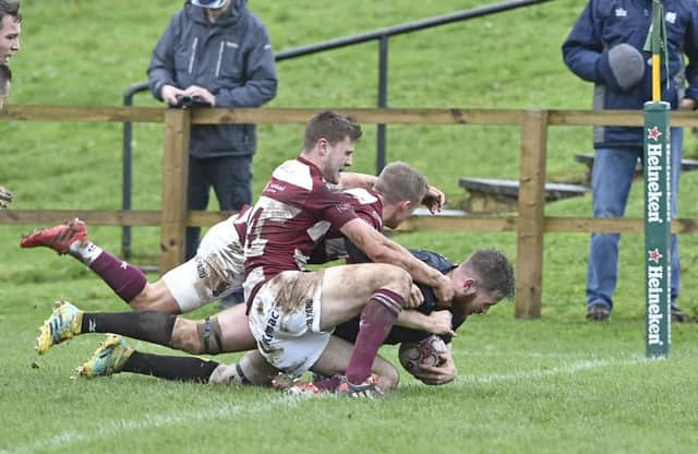 Currie Chieftains Scott McGinley powers over for a second half try despite some close attention. Photograph: Neil Hanna    Picture: Neil Hanna