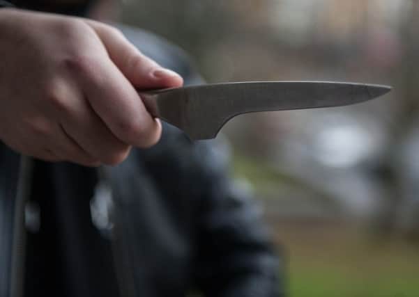 Stock shot of man with knife. Picture: John Devlin/TSPL