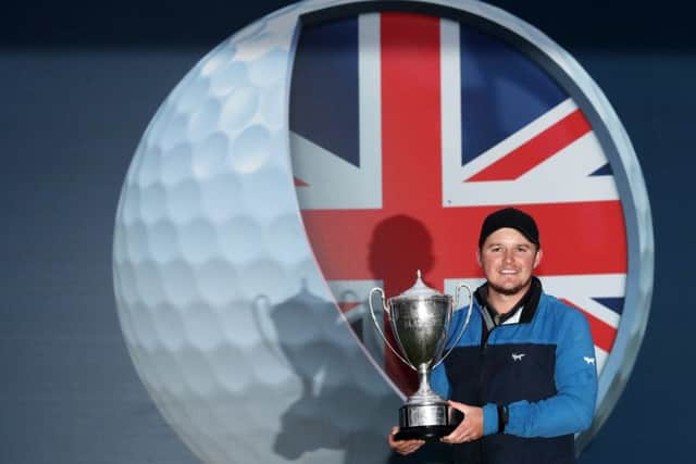 Eddie Pepperell with the British Masters trophy.