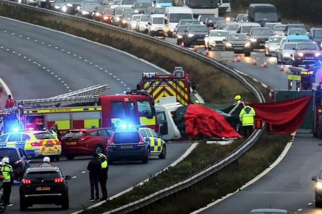Emergency services on the scene on the M40, which reopened 14 hours after a crash involving a caravan driving the wrong way. Picture: SWNS