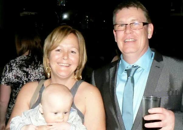 Lex Warner pictured on his 50th birthday with his wife Debbie and their son Vincent, now six. Picture: SWNS