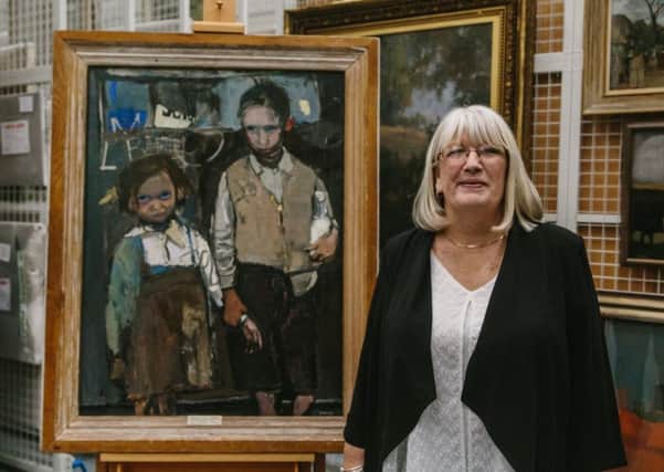 Margaret Livingstone with the painting Brother and Sister in which she features as a young girl. PIC: Contributed/ Grant Anderson.
