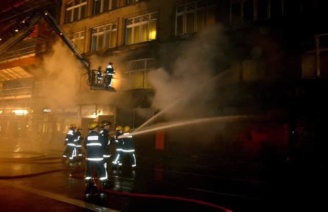 Firefighters tackle the blaze on South Bridge in Edinburgh, Saturday December 7 2002.  Edinburgh's biggest fire in a long time started in the Cowgate destroying the Gilded Balloon.