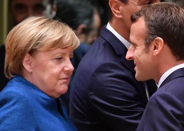 Germany's Angela Merkel, seen with Emmanuel Macron of France, is the longest-serving head of government in Europe (Picture: AFP/Getty)