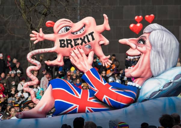 A float in the Rose Monday parade in Dusseldorf, known for biting political satire, sums up German feelings about Brexit (Picture: Lukas Schulze/Getty)
