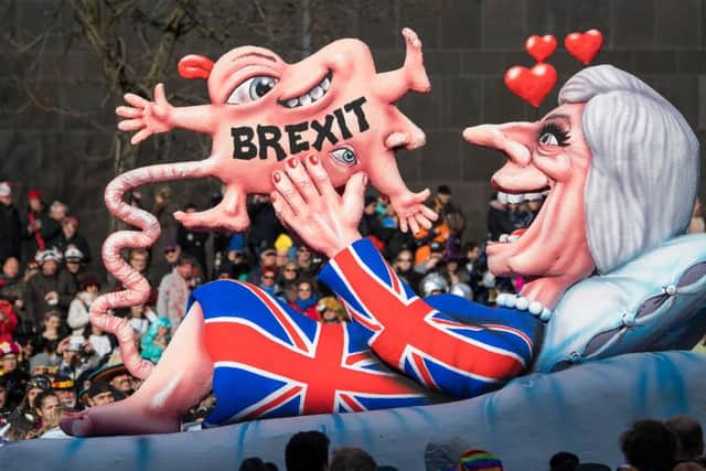 A float in the Rose Monday parade in Dusseldorf, known for biting political satire, sums up German feelings about Brexit (Picture: Lukas Schulze/Getty)