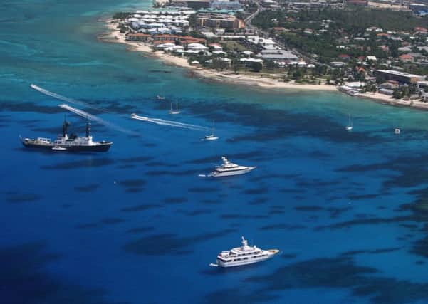 British Overseas Territories like the CaymansÃ¿ make UK alluring for corrupt individuals, says Transparency International (Picture: David Rogers/Getty Images)