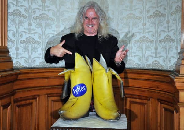 Sir Billy Connolly and his 'big banana boots' (Picture: Robert Perry)