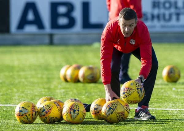 Jim McIntyre gets straight down to business at the training ground yesterday after being appointed as the new manager of Dundee. Picture: SNS.
