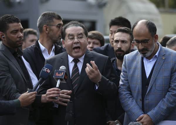 Dissident Ayman Nour, second left, and Turan Kislakci, right, of the Turkish-Arab media association, talk to reporters about the disappearance. Picture: AP