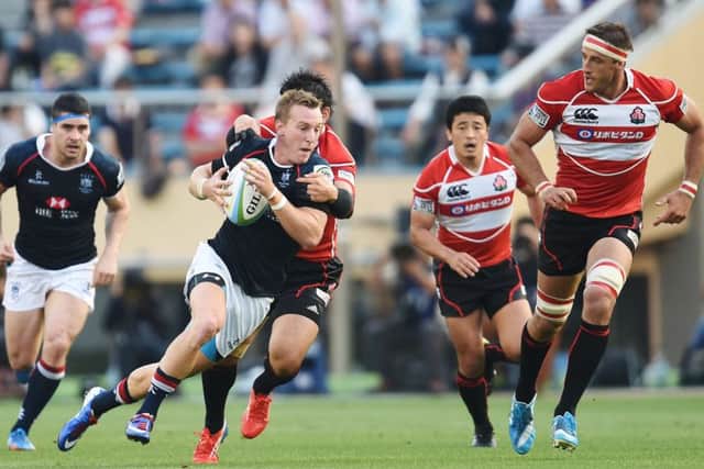 Hong Kong (dark blue) take on Japan in the Asian five nations. Picture: Atsushi Tomura/Getty