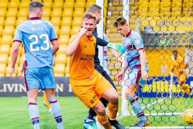 Livingston's Alan Lithgow celebrates after making it 3-0 over Dundee. Picture: SNS Group