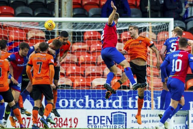 Inverness' Coll Donaldson (5) rises highest to header the visitors level. Picture: SNS Group