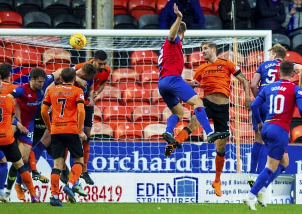 Inverness' Coll Donaldson (5) rises highest to header the visitors level. Picture: SNS Group