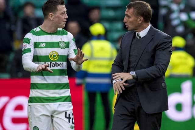 Celtic's Callum McGregor with manager Brendan Rodgers at full time. Picture: SNS.