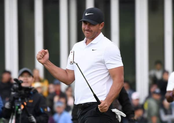Brooks Koepka reacts to his CJ Cup win, a success with which he toppled Dustin Johnson as No 1. Picture: AFP/Getty
