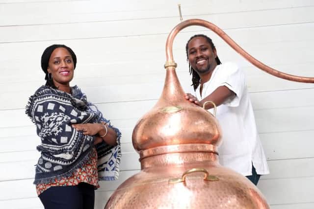 Chief executive Jacine Rutasikwa and master distiller Paul Rutasikwa at their rum distillery in Livingston. Picture: Stewart Attwood