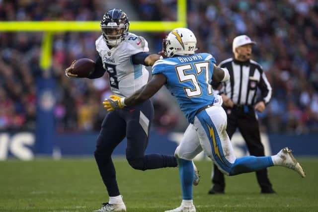 Tennessee Titans quarterback Marcus Mariota on the run against the Chargers. Picture: Justin Setterfield/Getty