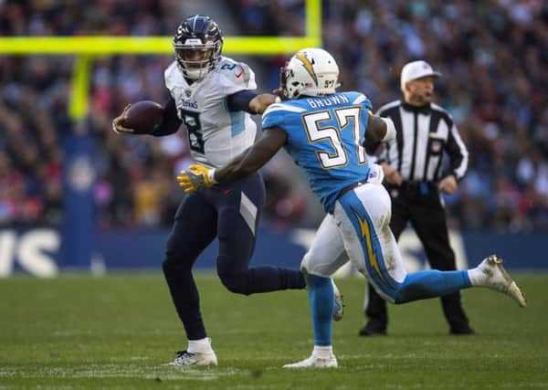 Tennessee Titans quarterback Marcus Mariota on the run against the Chargers. Picture: Justin Setterfield/Getty