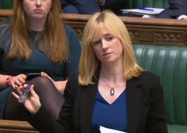 Labour MP for Canterbury, Rosie Duffield, holds up a medal from one of her constituents in the House of Commons in London. Picture; PA