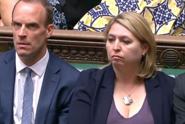 Dominic Raab and Northern Ireland Secretary Karen Bradley listens to Prime Minister Theresa May as she updates MPs in the House of Commons. Picture; PA