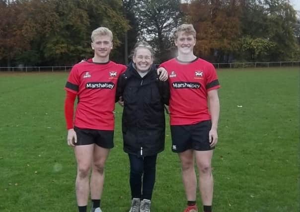 Callum Kennedy (left) and Timmy Kennedy (right), their mum Belinda (centre), in their final match for Glenrothes before Callum goes out to play in Australia with West Bulldogs
