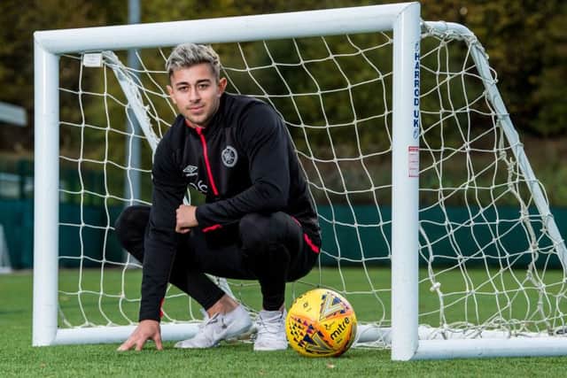 Hearts Marcus Godinho takes some time out from his preparations for tonights Premiership clash at Dundee. Picture: SNS