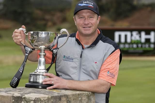 Greig Hutcheon with the M and H Logistics Scottish PGA Championship trophy. Picture: Picture: Alan Rennie