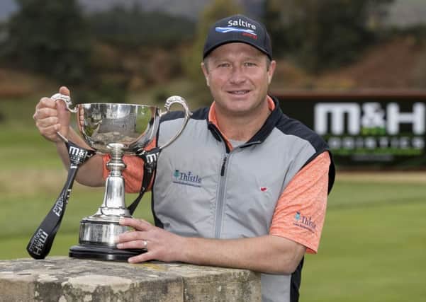 Greig Hutcheon with the M and H Logistics Scottish PGA Championship trophy. 
Picture: Picture: Alan Rennie