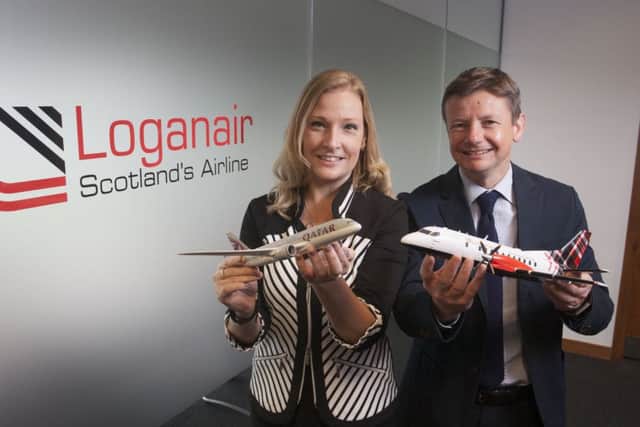 Jenna Donaldson, Qatars account manager, with Roy Bogle, Loganairs director of revenue. Picture: Contributed
