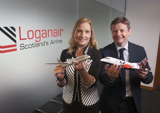 Jenna Donaldson, Qatars account manager, with Roy Bogle, Loganairs director of revenue. Picture: Contributed
