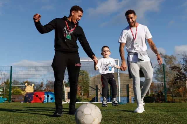 Tavernier and Connor Goldson visit Robin House to meet with young Rangers fan Kenzie. Picture: Stuart Wallace