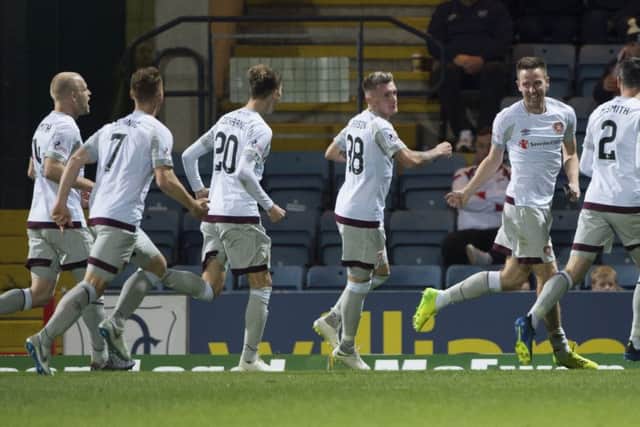 Steven MacLean (far right) celebrates scoring his side's third goal. Picture: SNS Group