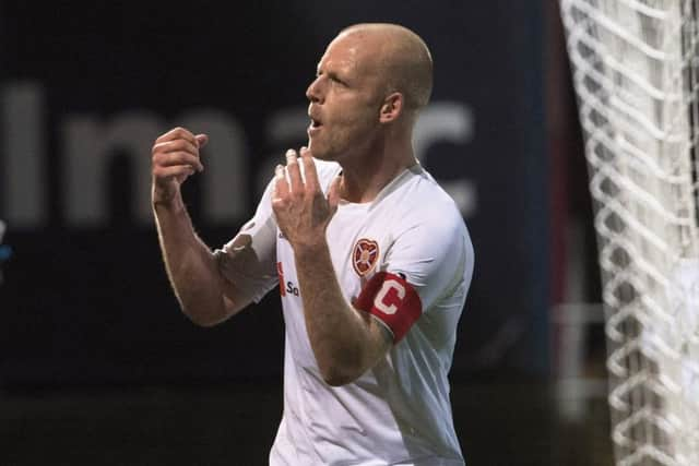 Steven Naismith celebrates behind the goal at Dens Park last night after making it 2-0 to Hearts. Picture: Bill Murray/SNS