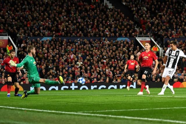 Paulo Dybala fires his shot past Manchester United goalkeeper David de Gea to give Juventus victory at Old Trafford. Picture: Getty