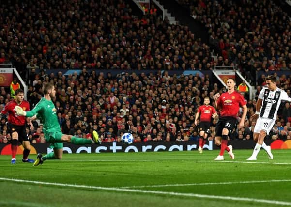 Paulo Dybala fires his shot past Manchester United goalkeeper David de Gea to give Juventus victory at Old Trafford. Picture: Getty