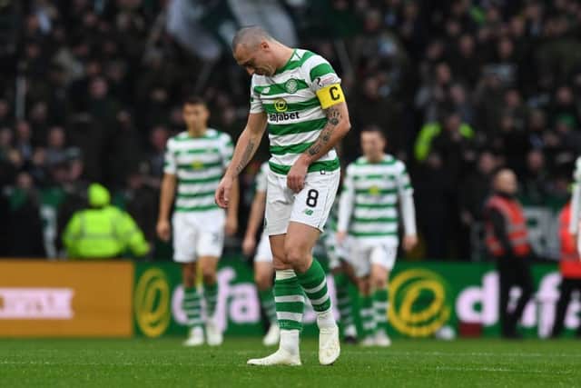 Celtic's Scott Brown shows his frustration at suffering an injury against Hibs. Picture: SNS