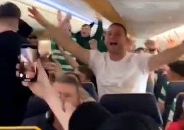 Celtic fans sing on the Ryanair flight. Picture: Twitter/@LiamUTLR