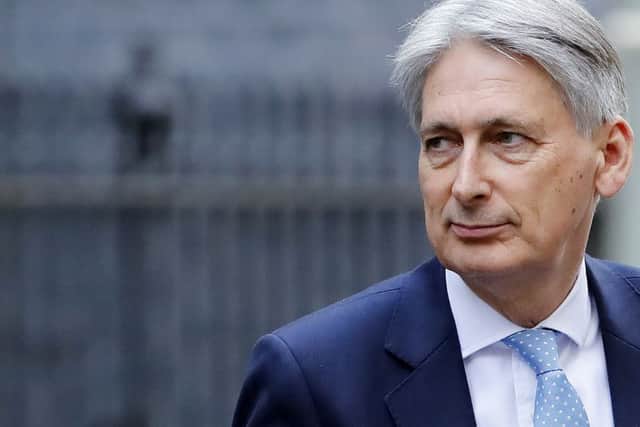 Is Philip Hammond about to fulfil Theresa Mays pledge about the end of austerity in Britain? (Picture: Tolga Akmen/AFP/Getty)