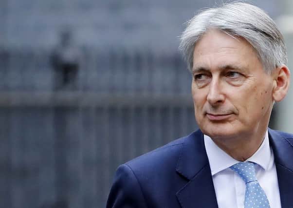 Is Philip Hammond about to fulfil Theresa Mays pledge about the end of austerity in Britain? Picture: Tolga Akmen/AFP/Getty.
