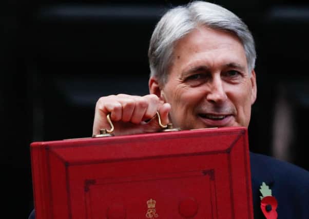 Philip Hammonds red box contained increases to the higher rate tax thresholdÃ¿ (Picture: Adrian Dennis/AFP/Getty)
