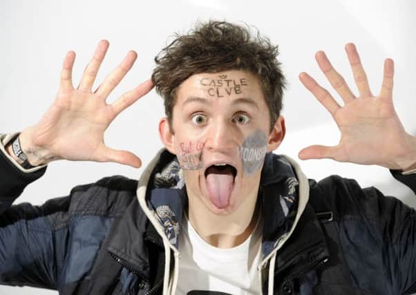 Jay Jones sold advertising space on his face to help pay off Â£9,000 worth of student debt (Picture: Greg Macvean)