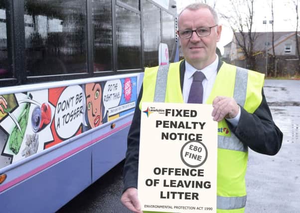 Councillor Michael McPake, convener of the Infrastructure Committee, is pictured with one of the bus adverts