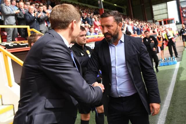 Derek McInnes, right, shakes hands with Steven Gerrard at Pittodrie on the opening weekend of the season. Picture: Craig Williamson/SNS