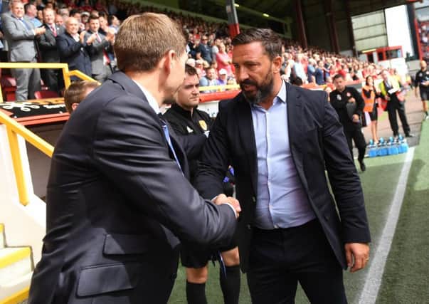 Derek McInnes, right, shakes hands with Steven Gerrard at Pittodrie on the opening weekend of the season. Picture: Craig Williamson/SNS