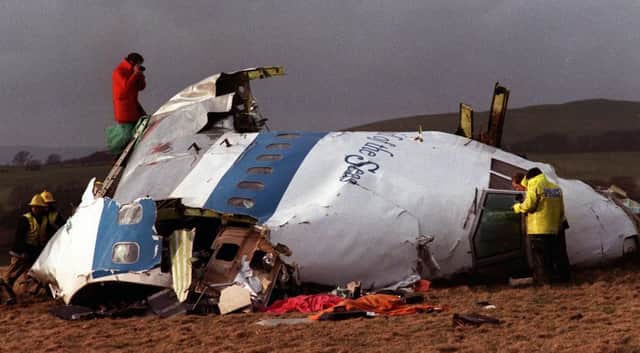 The remains of the flight deck of Pan Am 103 on a field in Lockerbie in 1988. Picture: AP