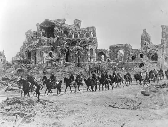 22nd August 1918: The British Cavalry passing the remains of Albert Cathedral, after the 2nd Battle of the Somme. (Photo by Hulton Archive/Getty Images)