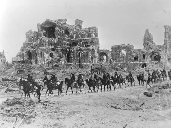 22nd August 1918:  The British Cavalry passing the remains of Albert Cathedral, after the 2nd Battle of the Somme.  (Photo by Hulton Archive/Getty Images)