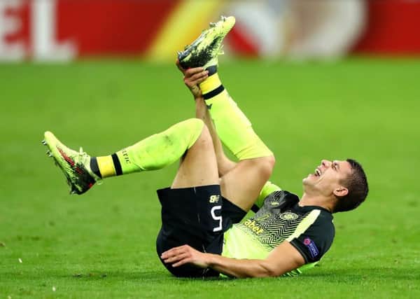 Celtic's Jozo Simunovic reacts to an ankle injury during the Europa League defeat by RB Leipzig.  Picture: Martin Rose/Bongarts/Getty Images