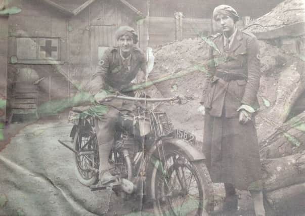 Trilby on a motorcyle with a fellow volunteer near the Front
